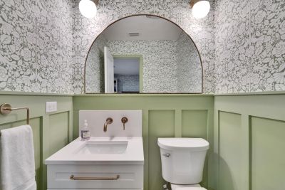 Green wallpapered bathroom 